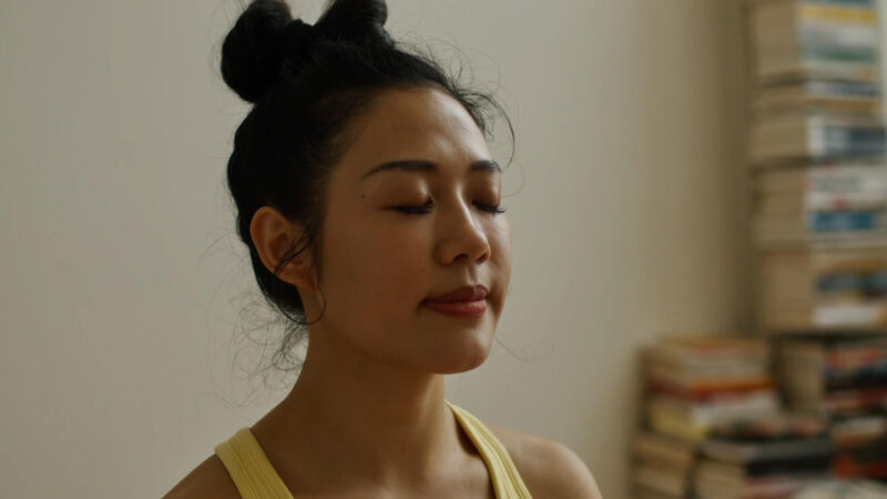 The woman practices MBSR, which helps her focus on her body and how it functions