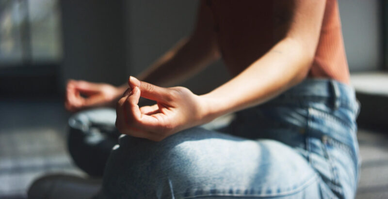 The girl meditates and reduces stress - Mindfulness technique